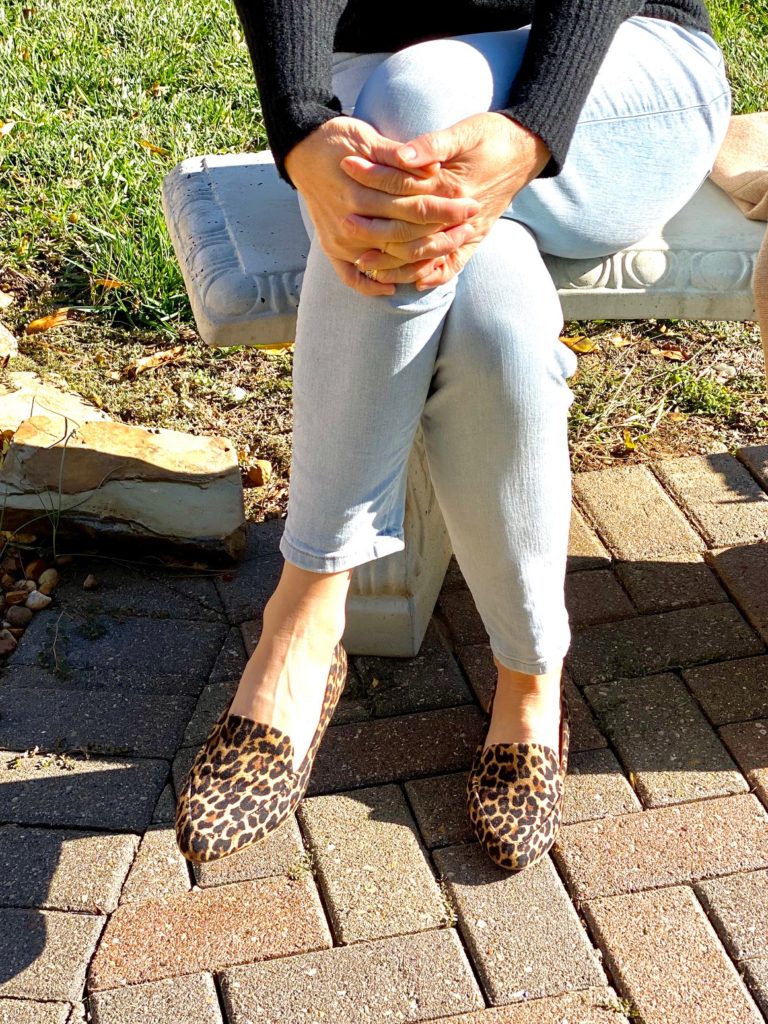 leopard print shoes on bench in back yard
