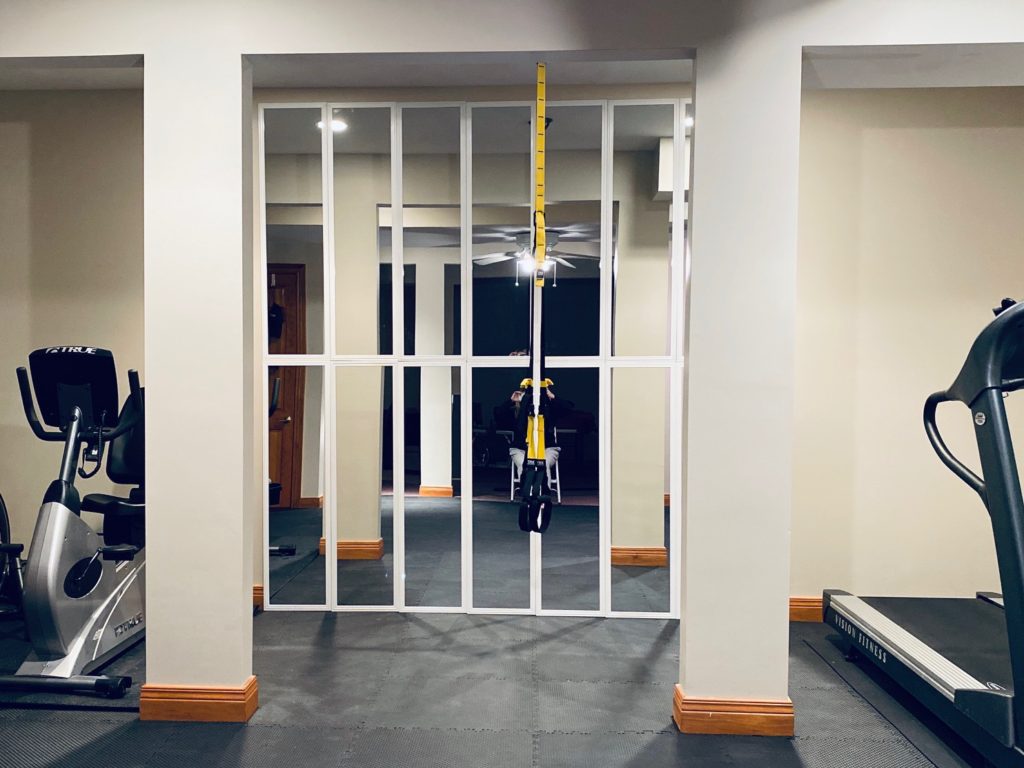vertical mirrored wall in home gym
