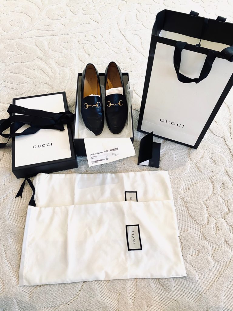 Flat lay of Gucci shoe purchase