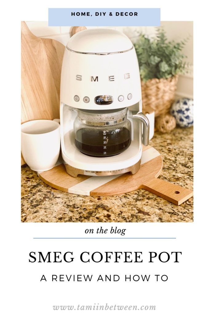A white SMEG coffee pot sitting on counter